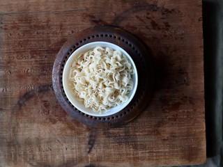 Twisted wavy noodles. Noodles in a black plate.