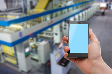 using touch screen mobile phone with Old factory garbage,Waste recycling plant