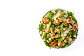 Caesar salad with lettuce,chicken and croutons isolated on white background. Top view. Copyspace