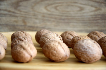  walnuts on wooden table close-up, selective focus