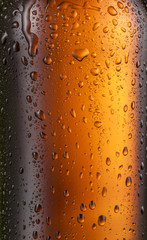 Misted glass of beer bottle. Close up shot.