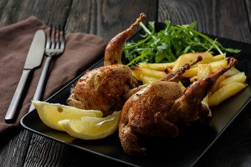 Grilled quails with fried potatoes and tomato dip.