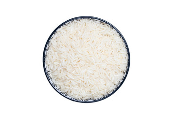 Vegetable food. Macro of a bowl with uncooked raw rice grains isolated on a white background. Healthy eating. Top view with space for product montage.