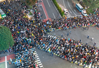 Unbelievable crowd of people in shibuya district during halloween celebration. Halloween has become...