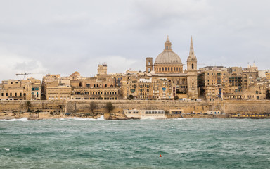 Fototapeta na wymiar Panoramic View on the Skyline of historical Valletta during a stormy day. Valletta, Malta, Europe