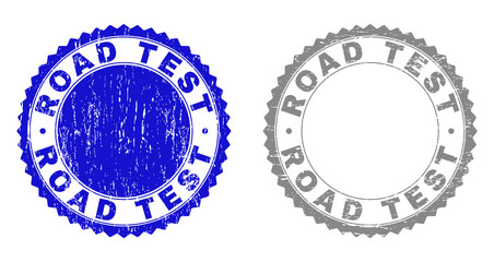 Obraz premium Grunge ROAD TEST stamp seals isolated on a white background. Rosette seals with grunge texture in blue and grey colors. Vector rubber stamp imitation of ROAD TEST tag inside round rosette.