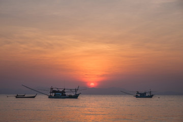 Thai fishing boat at sea during sunset