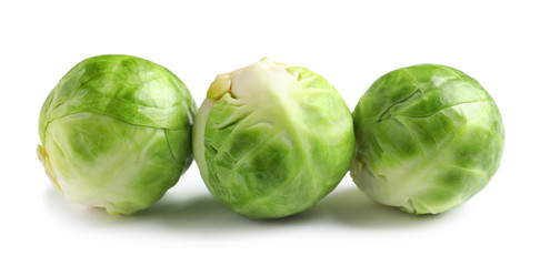 Fresh tasty Brussels sprouts on white background