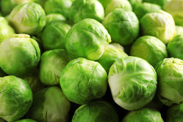 Pile of fresh Brussels sprouts as background