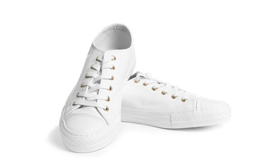 Pair of stylish sneakers on white background