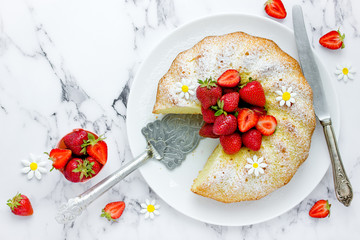 Fresh strawberry bundt cake, homemade  sponge cake ring shaped with strawberry slices