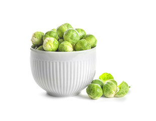 Bowl of fresh Brussels sprouts isolated on white