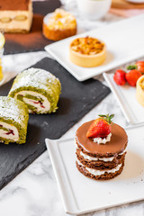 delicious strawberry and mint cakes on a white and black plate