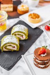 delicious strawberry and mint cakes on a white and black plate