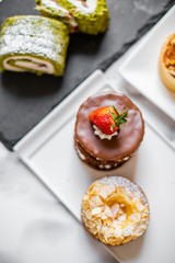 delicious strawberry and mint cakes on a white and black plate