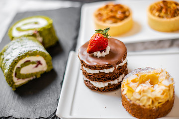 delicious strawberry and mint cakes on a white and black plate