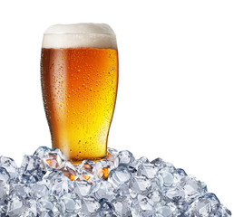 Chilled glass of light beer in ice cubes. File contains clipping path.