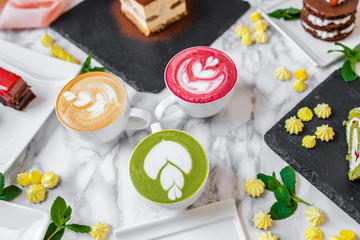 delicious composition of latte tea with cakes