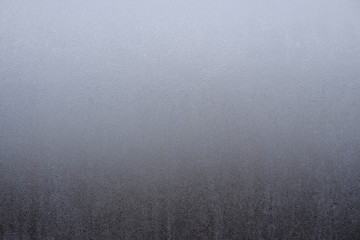 glass covered with hoarfrost. texture gray gradient