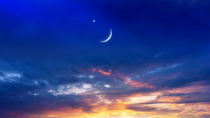 Naklejka na ściany i meble Crescent moon with beautiful sunset background . Generous Ramadan . Light from sky . Religion background . 