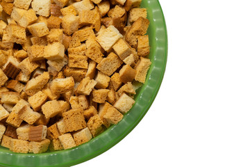 a top view of a bowl of crackers on a white background