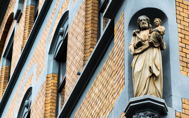 religious stature built into the corner of a building in Koblenz Germany