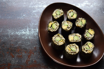 Sushi from cauliflower, avocado and tuna. Traditional Asian food. Diet healthy food concept. Cereal free. Gluten free. Dairy free. AIP Autoimmune Paleo.