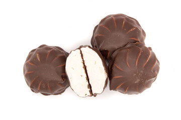 Marshmallows in chocolate. The isolated image on the white background.