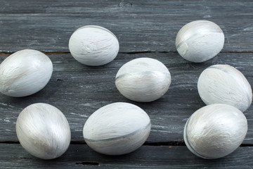 Happy Easter. Painted eggs on wooden table. Top view. Copy space for text.