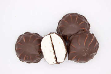 Marshmallows in chocolate. The isolated image on the white background.