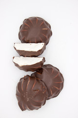 Marshmallows in chocolate. The isolated image on the white background.