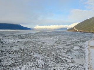 Ice waters of Cook Inlet and Chugach mountains in Alaska 