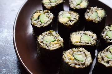 Sushi from cauliflower, avocado and tuna. Traditional Asian food. Diet healthy food concept. Cereal free. Gluten free. Dairy free. AIP Autoimmune Paleo.