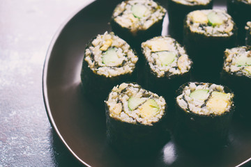 Sushi from cauliflower, avocado and tuna. Traditional Asian food. Diet healthy food concept. Cereal free. Gluten free. Dairy free. AIP Autoimmune Paleo.