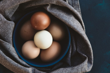 Fresh rustic brown eggs in bowl.