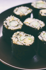 Sushi from cauliflower, avocado and tuna. Traditional Asian food. Diet healthy food concept. Cereal free. Gluten free. Dairy free. AIP Autoimmune Paleo.