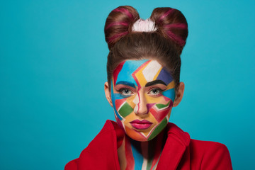 Confident model posing with pop art make up.