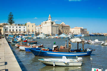 Fototapeta na wymiar View of a nice fishing harbor and marina in Trani, region Puglia, Italy