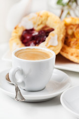 Breakfast setup with Danish pastries and coffee