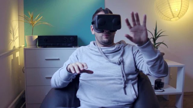 men in lazy bag enjoying vr at home virtual reality googles 