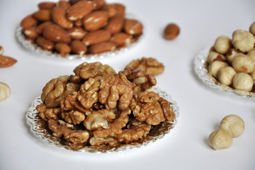 mixed nuts in a bowl isolated on white background
