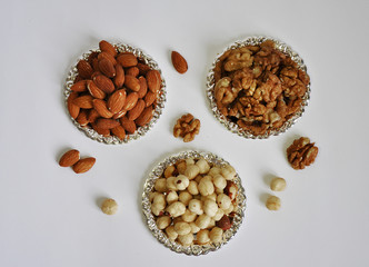 mixed nuts in a bowl isolated on white background