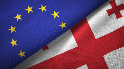 Fototapeta premium European Union and Georgia two flags textile cloth, fabric texture