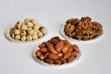 mixed nuts in a bowl isolated on white background