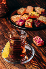 Tea in armudu glass with rahat lokum