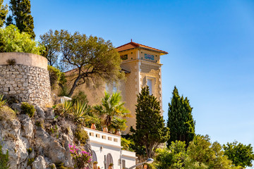 Mountain slopes with historic buildings in Nice, France.