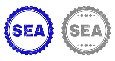 Grunge SEA stamp seals isolated on a white background. Rosette seals with distress texture in blue and gray colors. Vector rubber stamp imprint of SEA title inside round rosette.