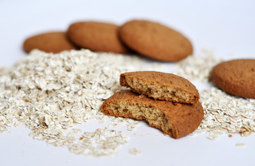 oatmeal cookies and oats on white background