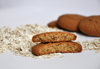 oatmeal cookies and oats on white background
