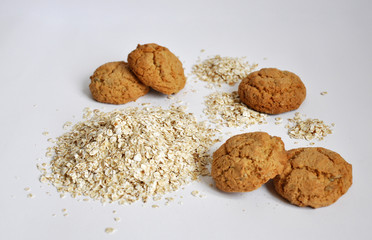 oatmeal cookies and oats on white background